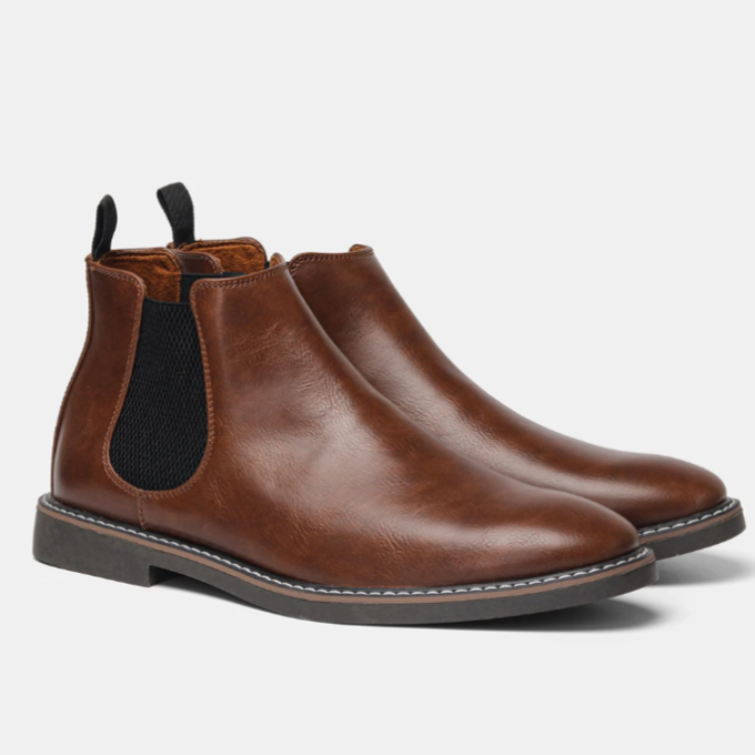 Unisex Chelsea boots with elastic side panels, pull tabs and low heels