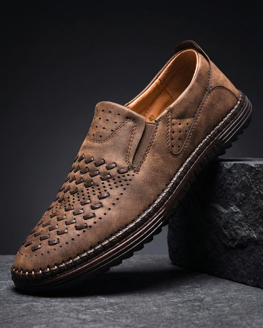 Perforated slip-on loafers with stitched sole trim and ridged tread