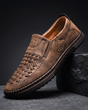 Perforated slip-on loafers with stitched sole trim and ridged tread