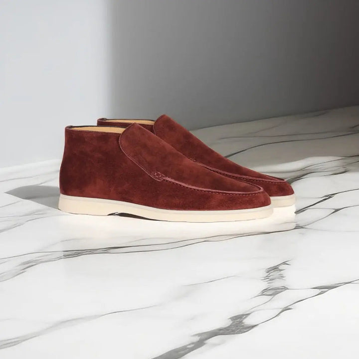 Men's slip-on loafers with stitched moccasin detailing and flat contrasting soles