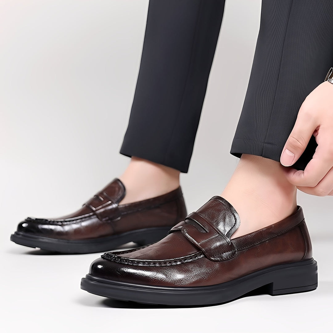 Men's formal loafers with moc toe stitching, penny strap and low heel
