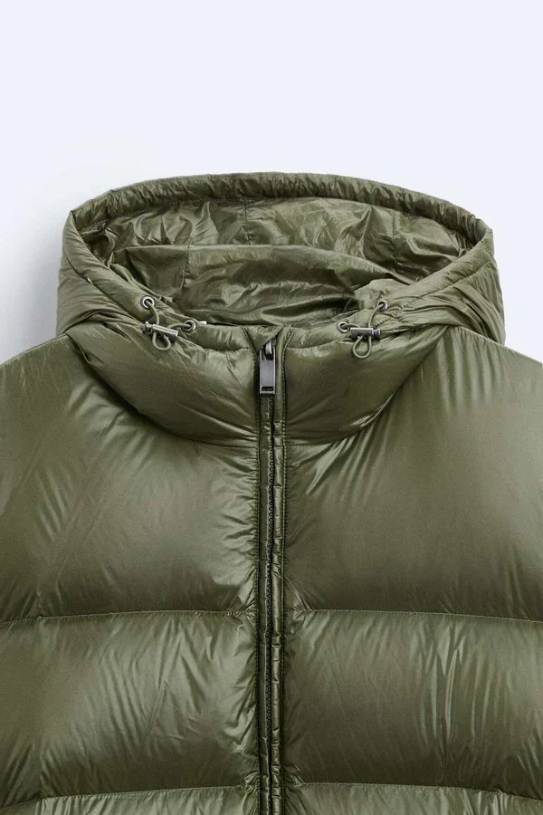 Quilted hooded puffer jacket with front zip and angled pockets