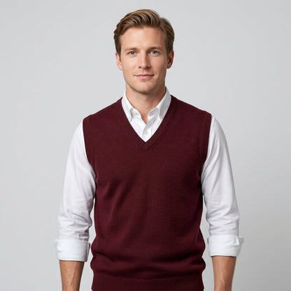 Men's sleeveless V-neck knitted sweater vest layered over a collared shirt