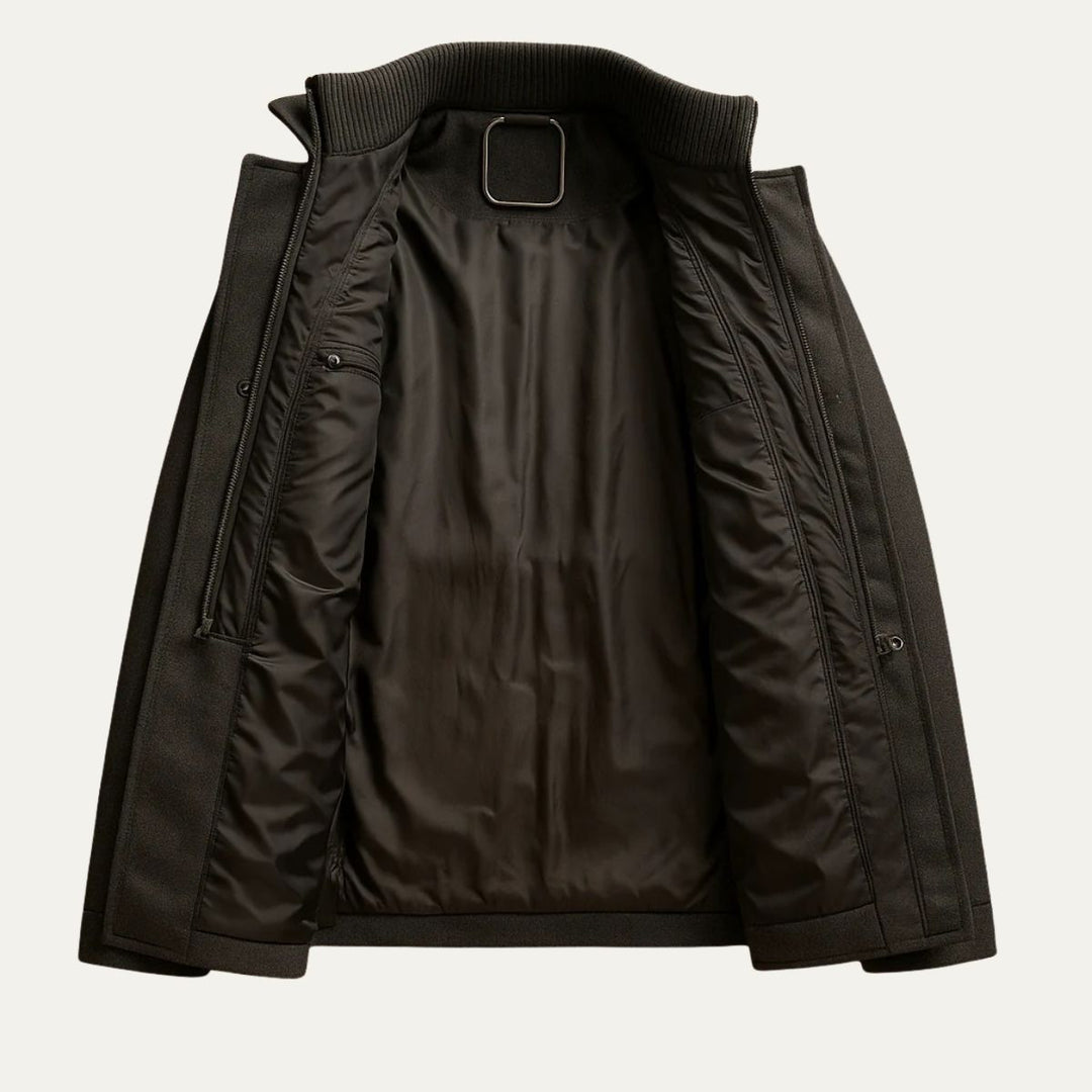 Men's long structured button coat with raised collar, chest pockets and cuff tabs
