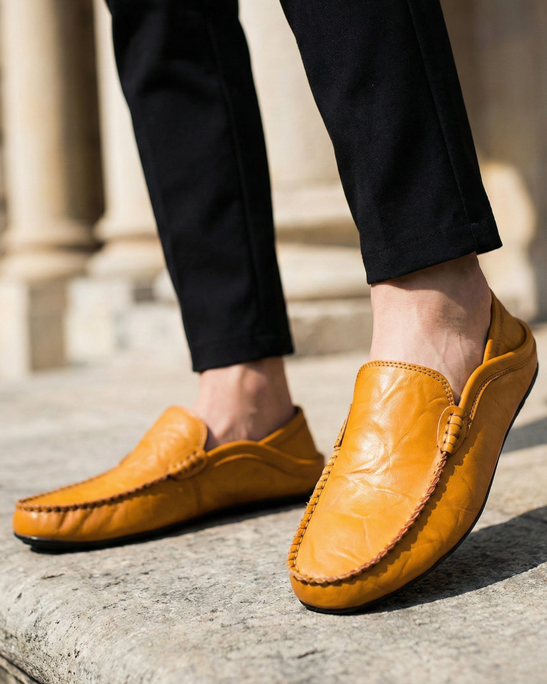 Unisex moc toe loafers with braided side trim and flat dark soles