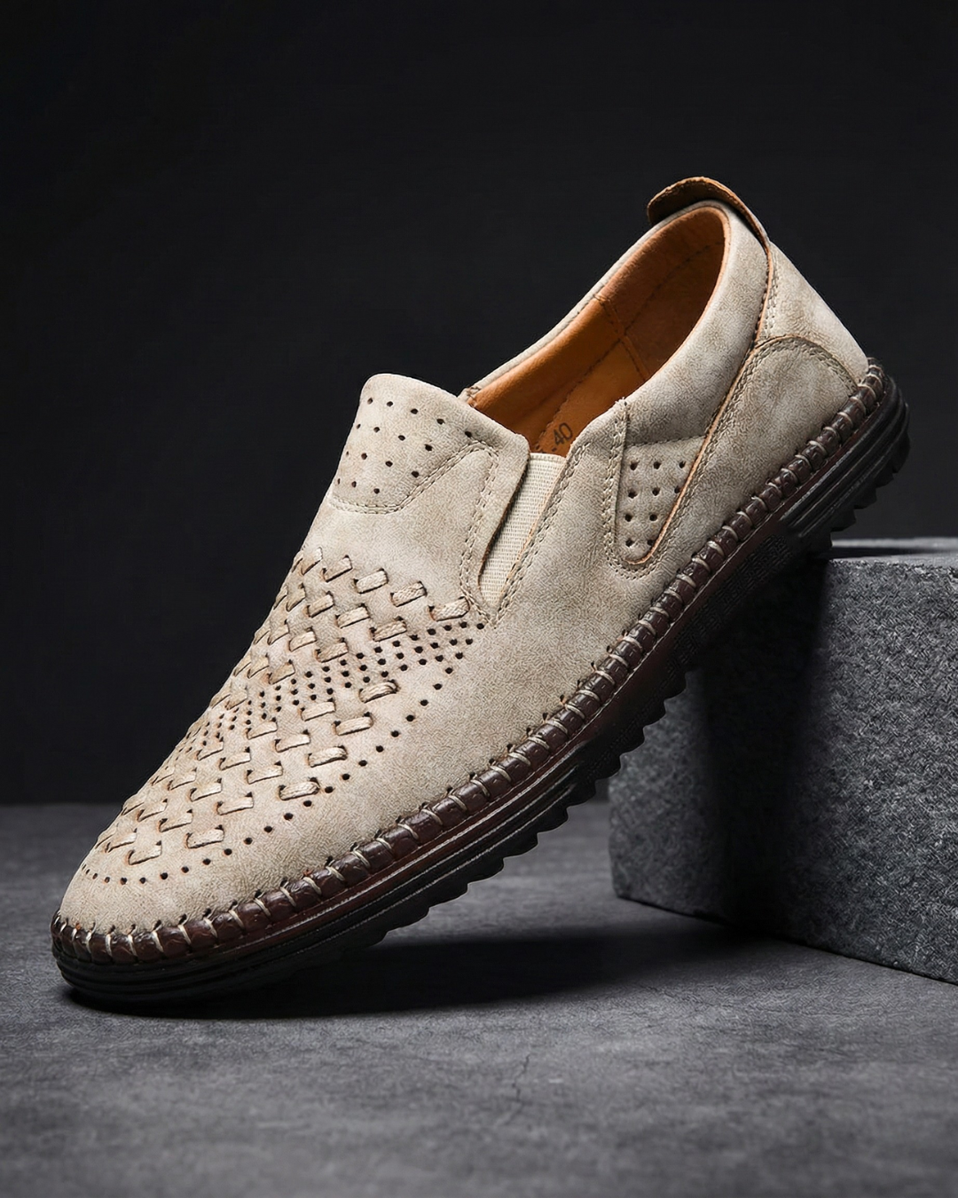 Perforated slip-on loafers with stitched sole trim and ridged tread