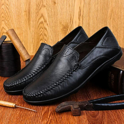 Men's slip-on loafer with moccasin stitching, perforated detail and textured flat sole