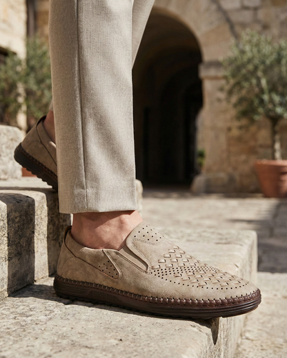 Perforated slip-on loafers with stitched sole trim and ridged tread