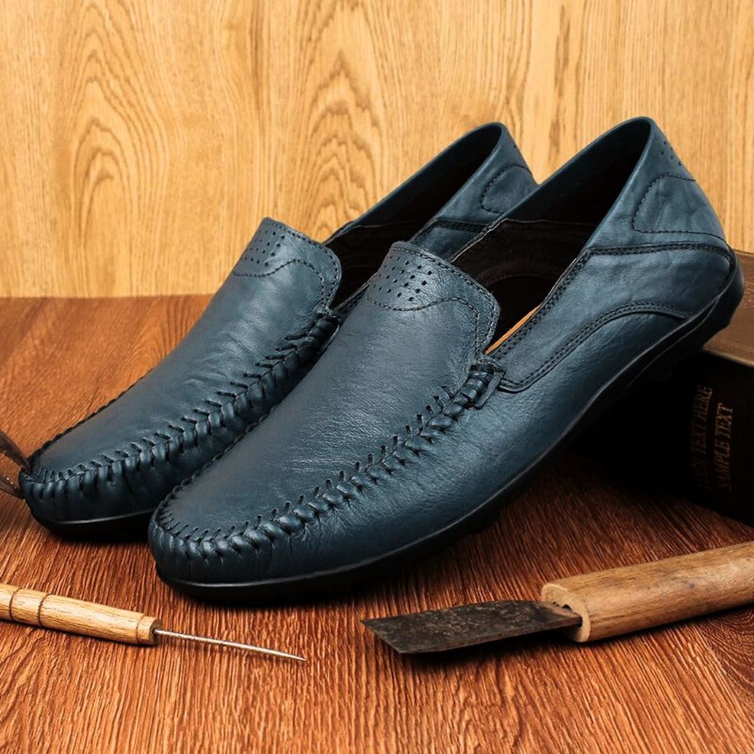 Men's slip-on loafer with moccasin stitching, perforated detail and textured flat sole