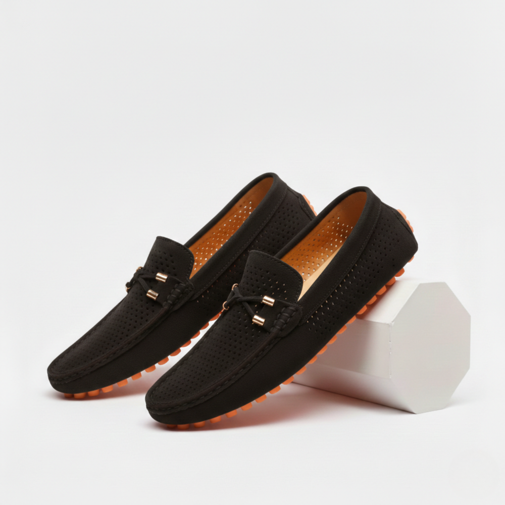 Men's perforated slip-on loafers with decorative vamp detail and flat ridged soles