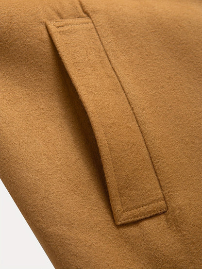 Men's tailored longline trench coat with lapels, buttons and angled side pockets