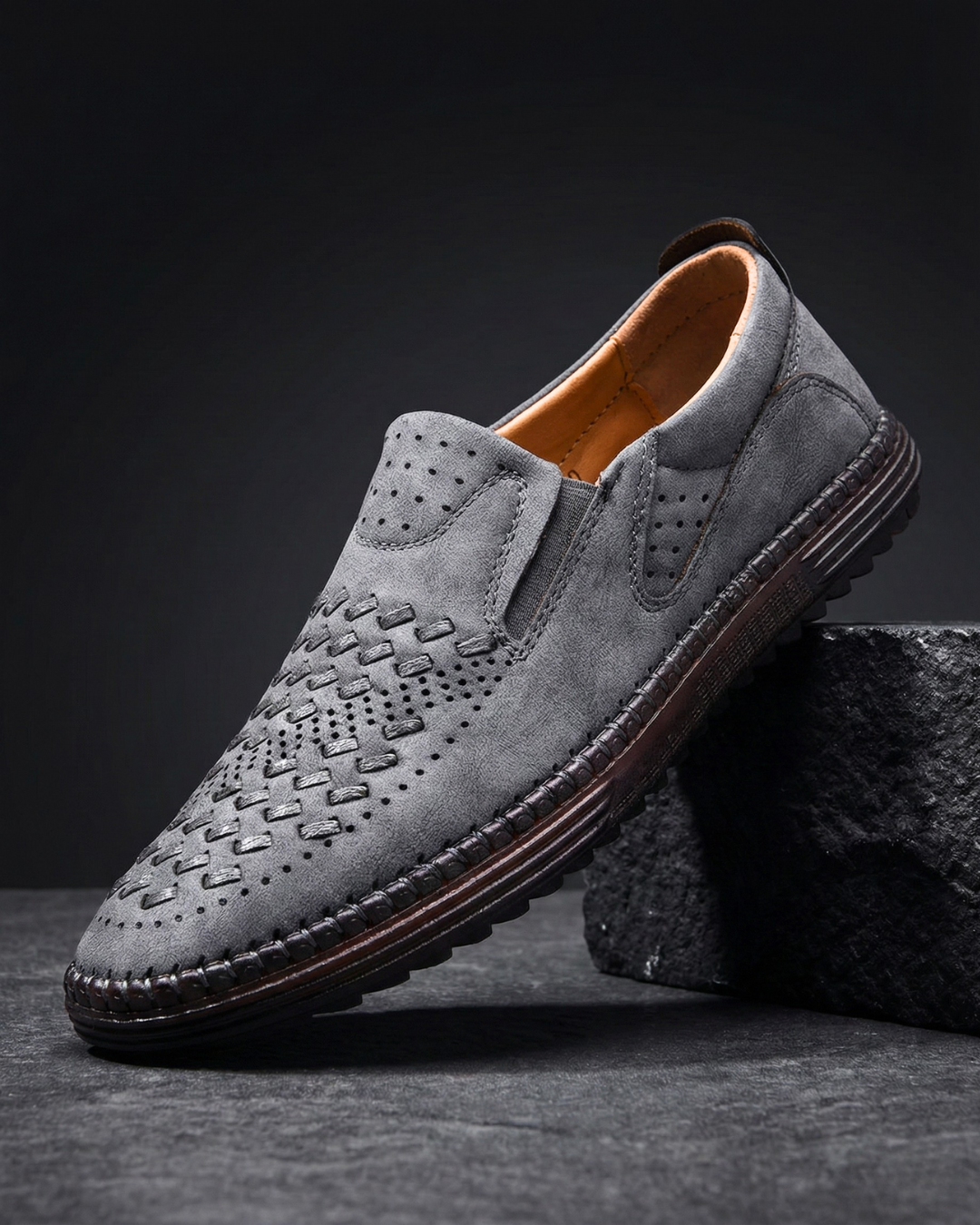 Perforated slip-on loafers with stitched sole trim and ridged tread