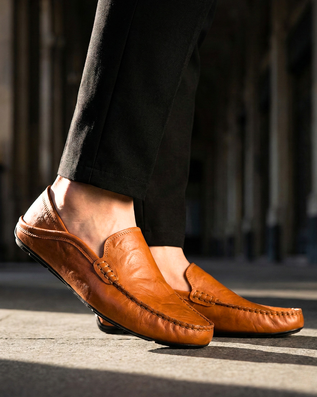Unisex moc toe loafers with braided side trim and flat dark soles
