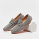 Men's perforated slip-on loafers with decorative vamp detail and flat ridged soles