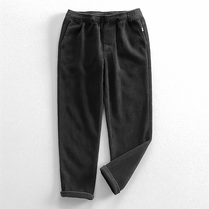 Corduroy pants with elastic waist, side pockets and tapered legs