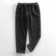 Corduroy pants with elastic waist, side pockets and tapered legs