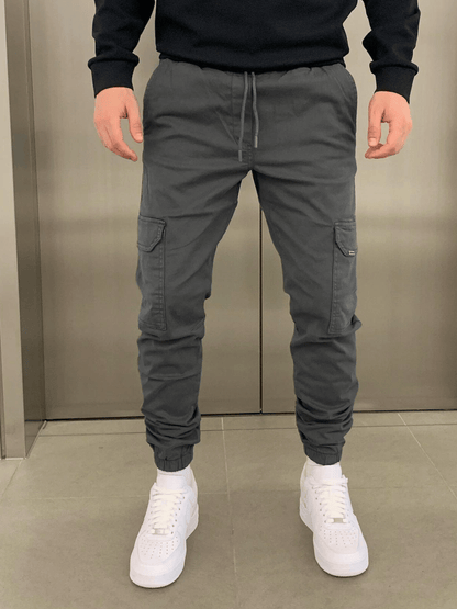 Men's tapered cargo trousers with drawstring waist, thigh pockets and elasticated cuffs