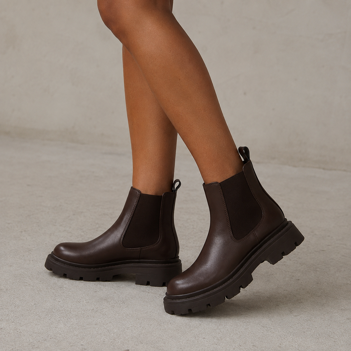 Chelsea boots with elastic side panels, rear pull tabs and chunky lug soles