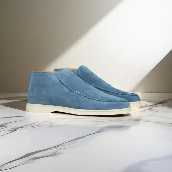 Men's slip-on loafers with stitched moccasin detailing and flat contrasting soles