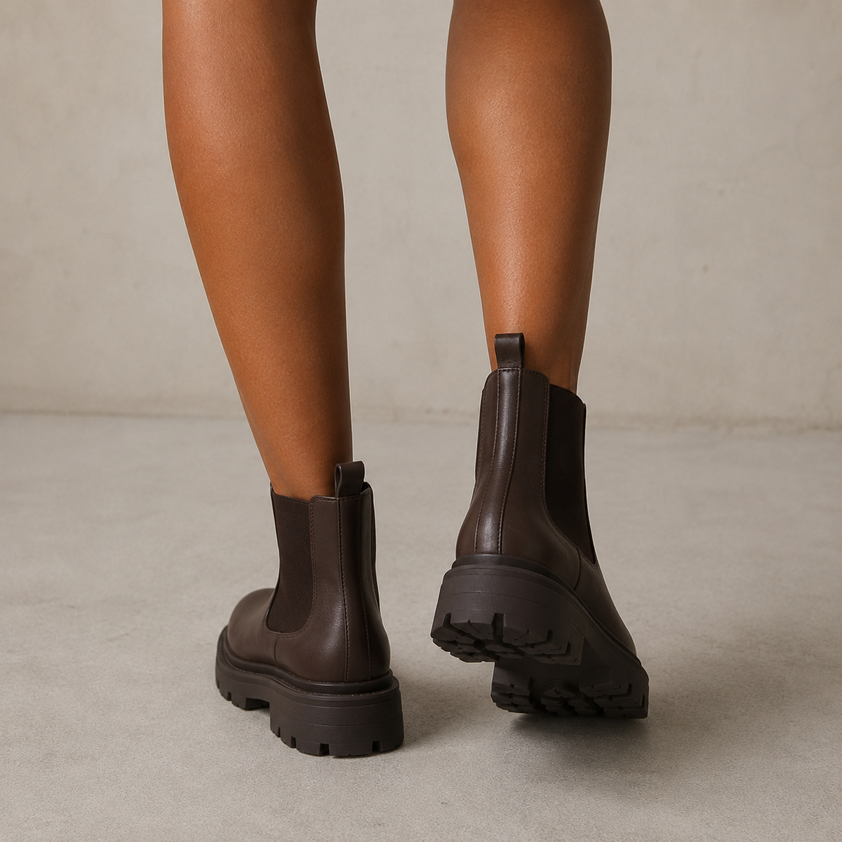 Chelsea boots with elastic side panels, rear pull tabs and chunky lug soles
