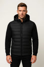 Men's black hooded puffer jacket with quilted panels and zip fastening