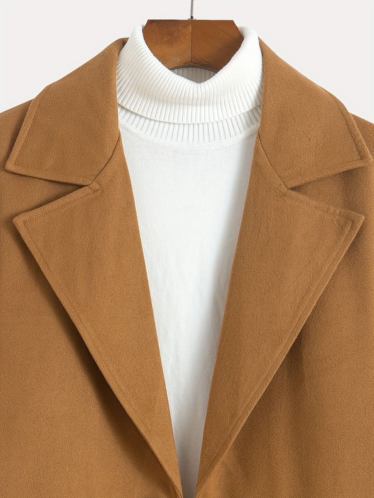 Men's tailored longline trench coat with lapels, buttons and angled side pockets
