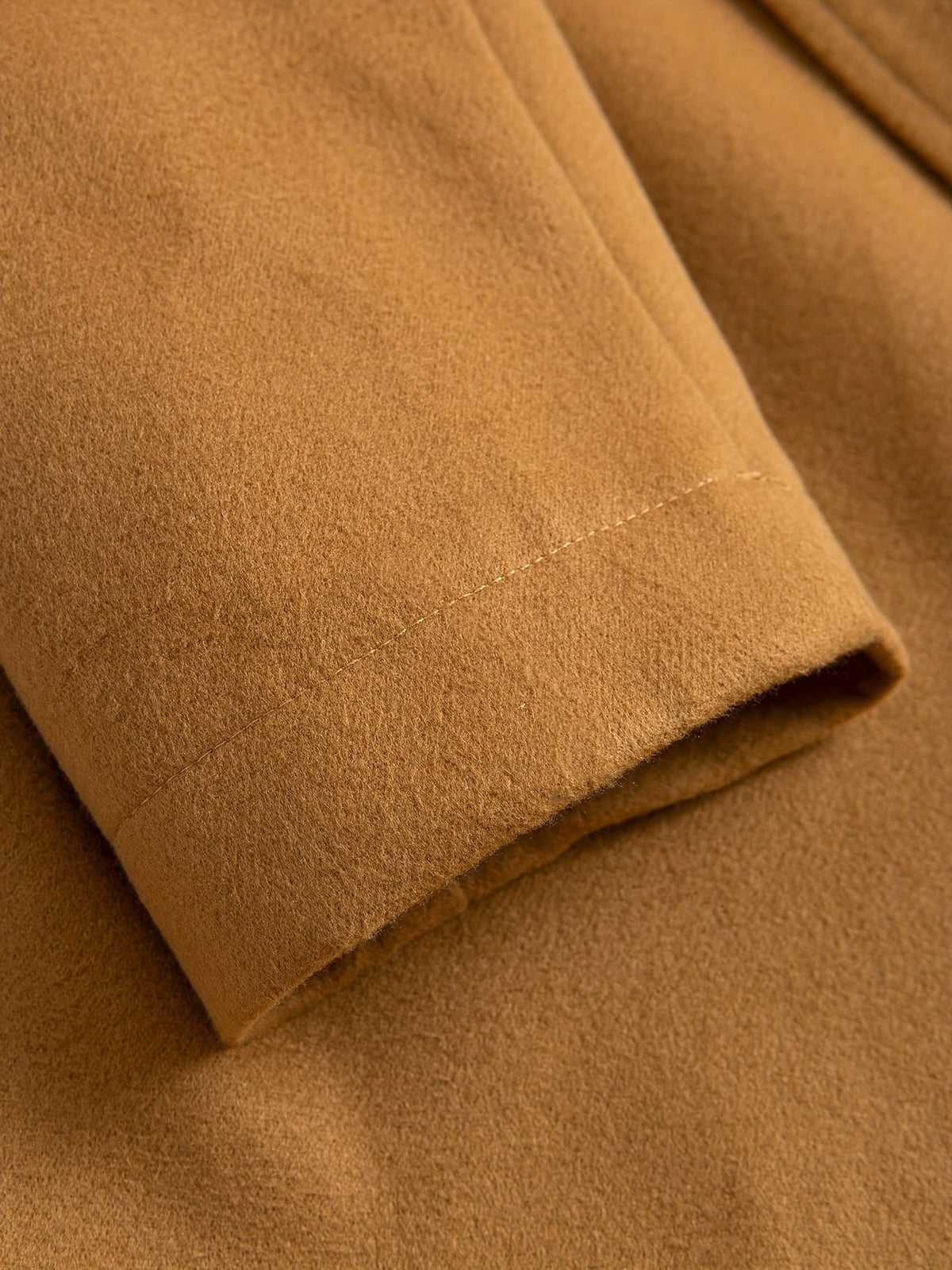 Men's tailored longline trench coat with lapels, buttons and angled side pockets