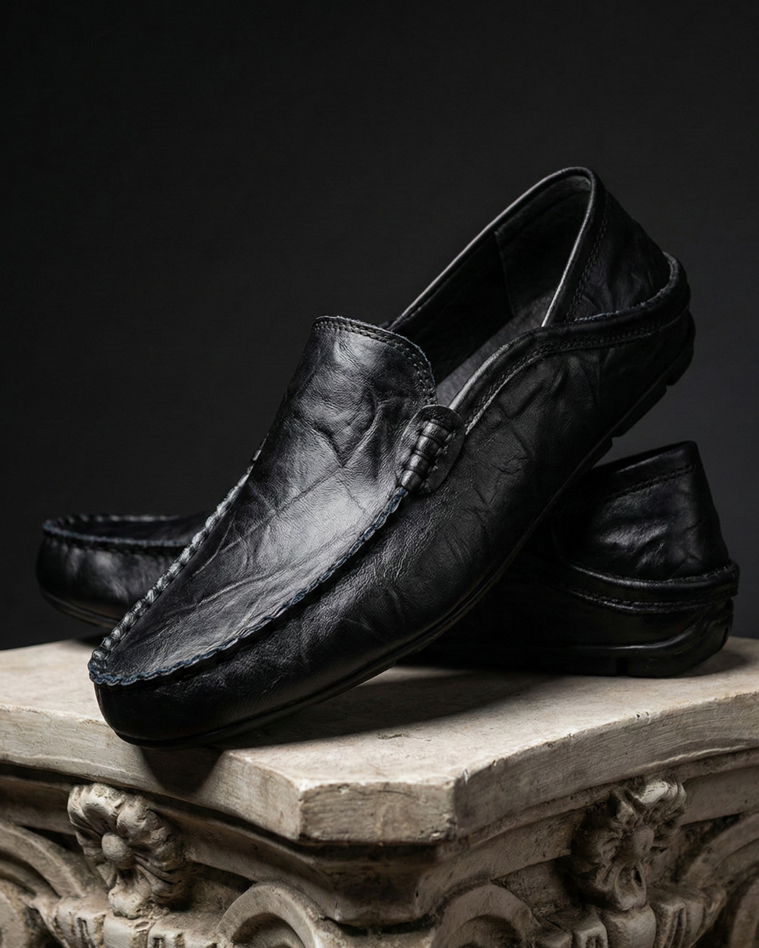 Unisex moc toe loafers with braided side trim and flat dark soles