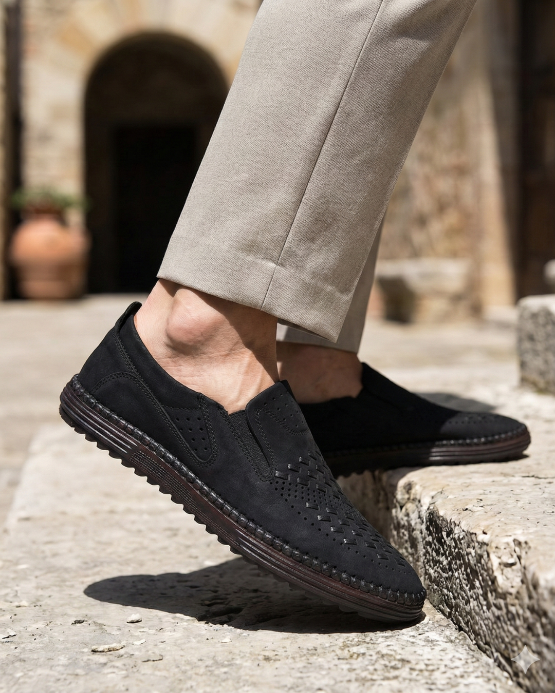 Perforated slip-on loafers with stitched sole trim and ridged tread