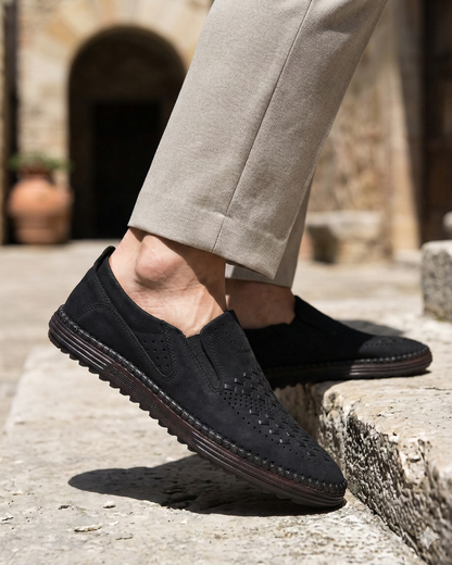 Perforated slip-on loafers with stitched sole trim and ridged tread