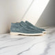 Men's slip-on loafers with stitched moccasin detailing and flat contrasting soles