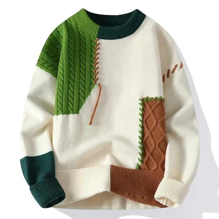 Patchwork cable knit sweater with contrasting panels and crew neckline