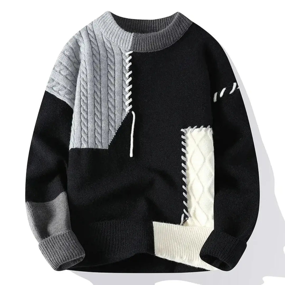 Patchwork cable knit sweater with contrasting panels and crew neckline