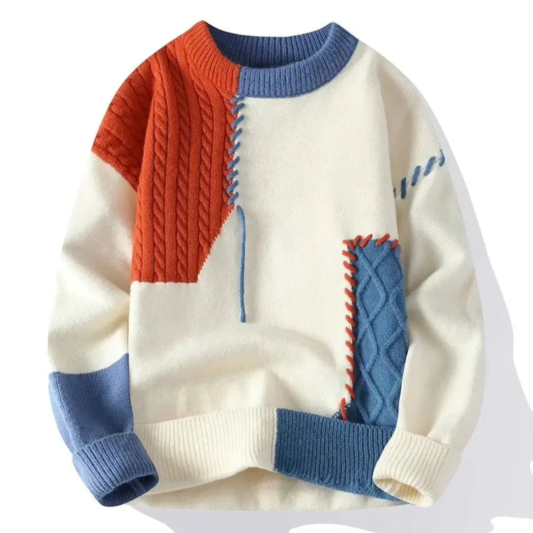 Patchwork cable knit sweater with contrasting panels and crew neckline