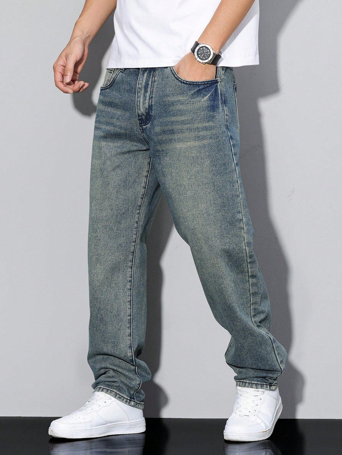 Men's loose straight leg jeans shown in grey and blue denim washes