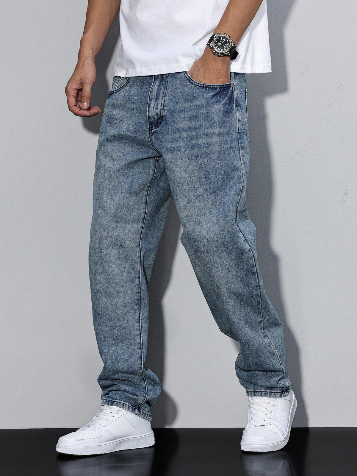 Men's loose straight leg jeans shown in grey and blue denim washes