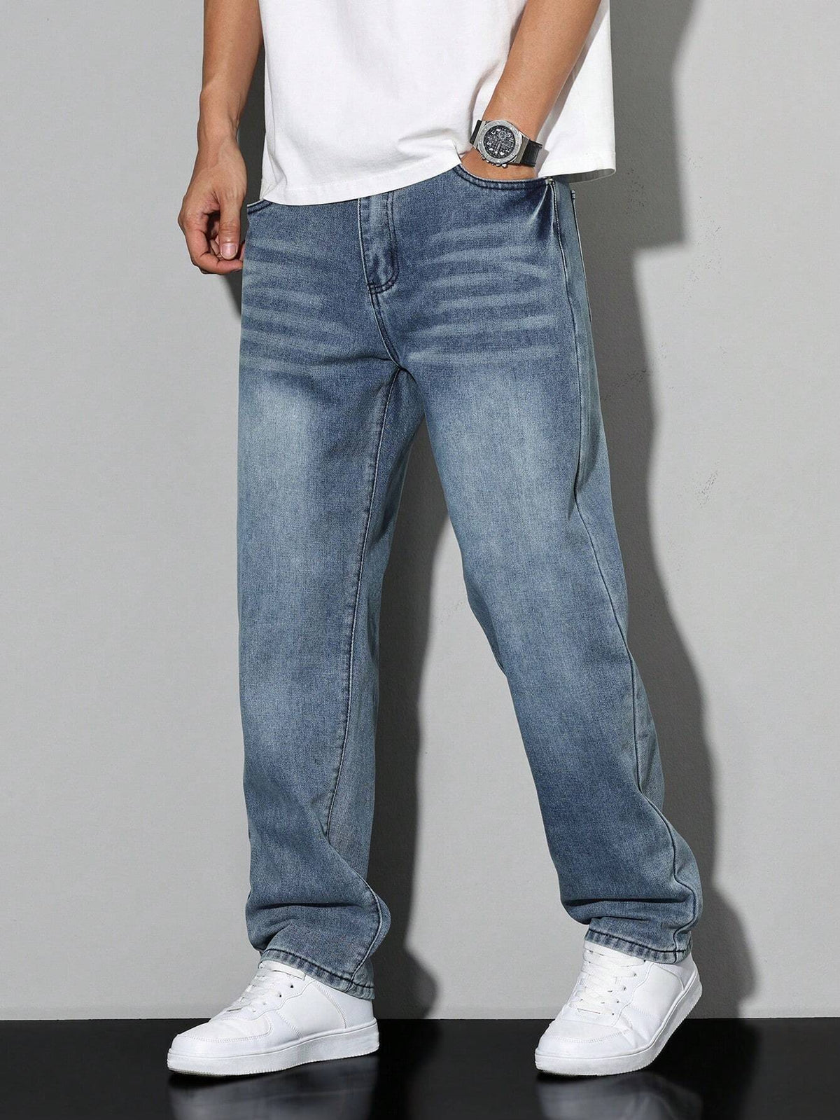 Men's loose straight leg jeans shown in grey and blue denim washes