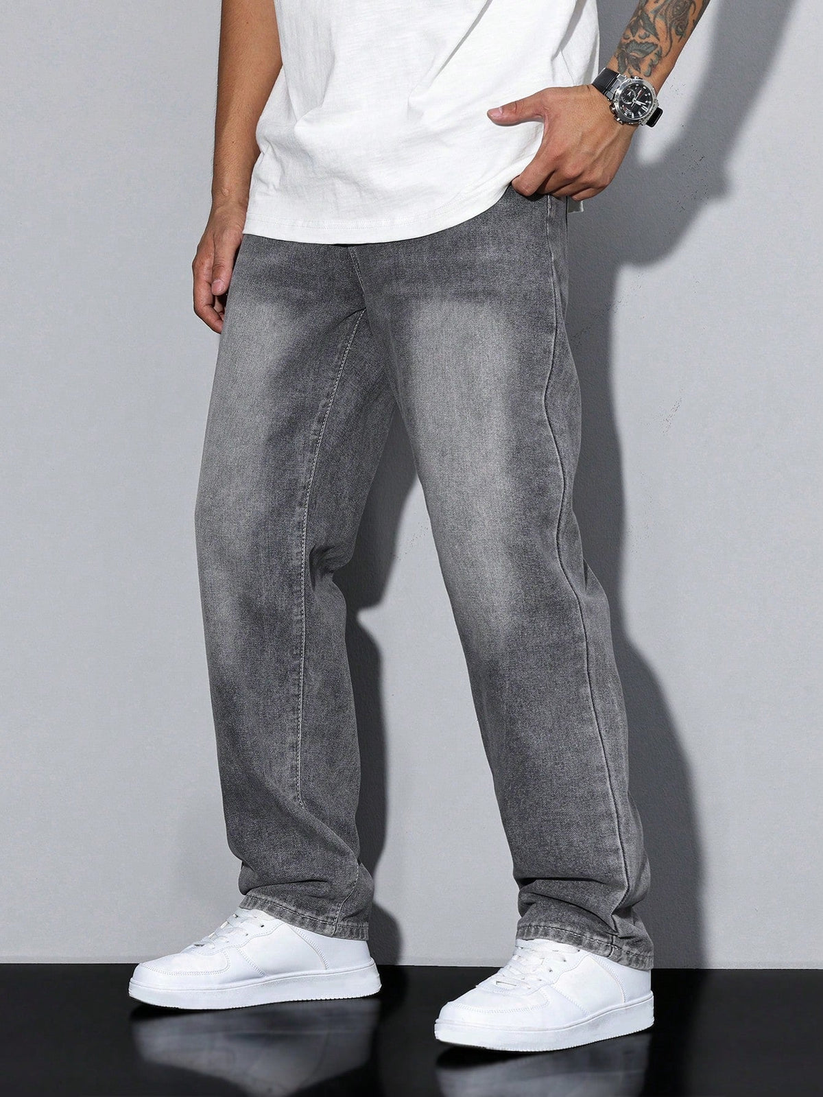 Men's loose straight leg jeans shown in grey and blue denim washes