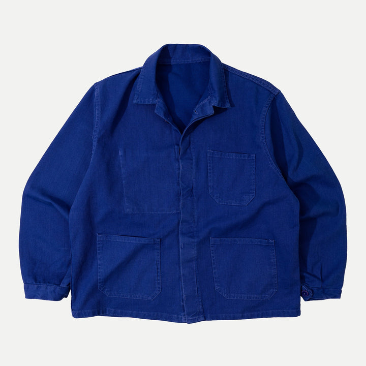 Men's blue collared work jacket with button front and patch pockets