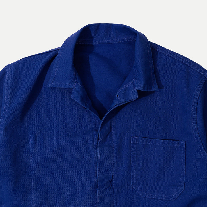 Men's blue collared work jacket with button front and patch pockets