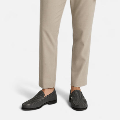 Men's perforated slip-on loafer with moc toe stitching and low heel