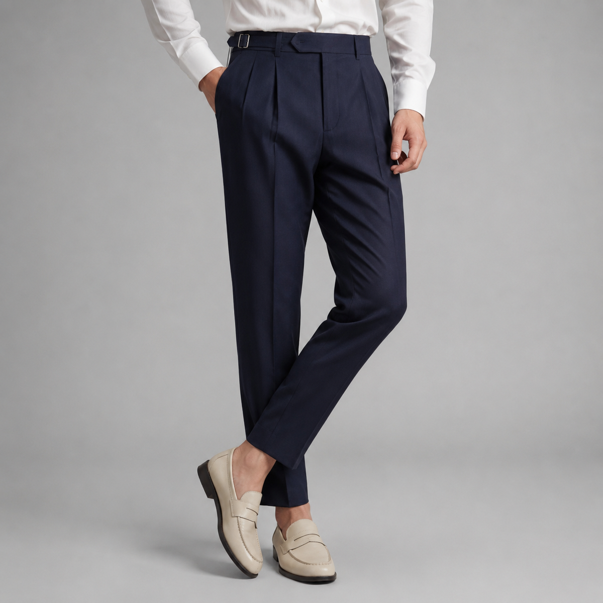 Men's tailored trousers with pleated front, buckle waist and straight full-length legs