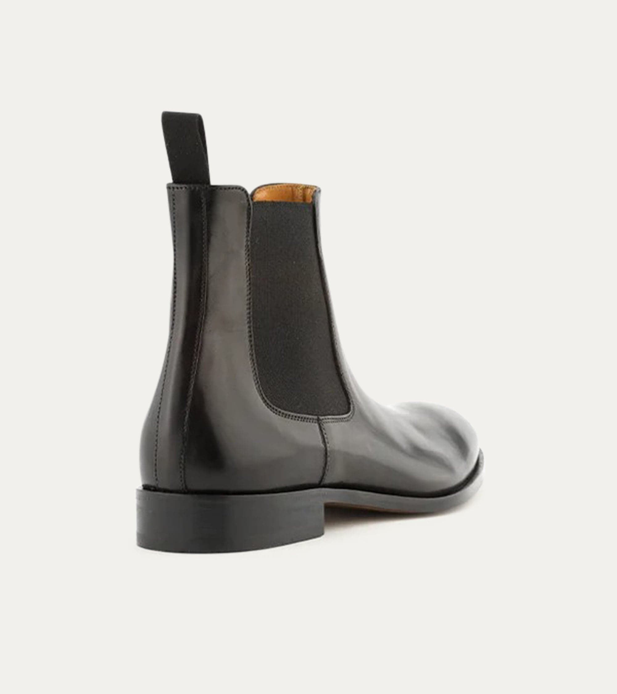Black Chelsea boot with rounded toe and elastic side panels