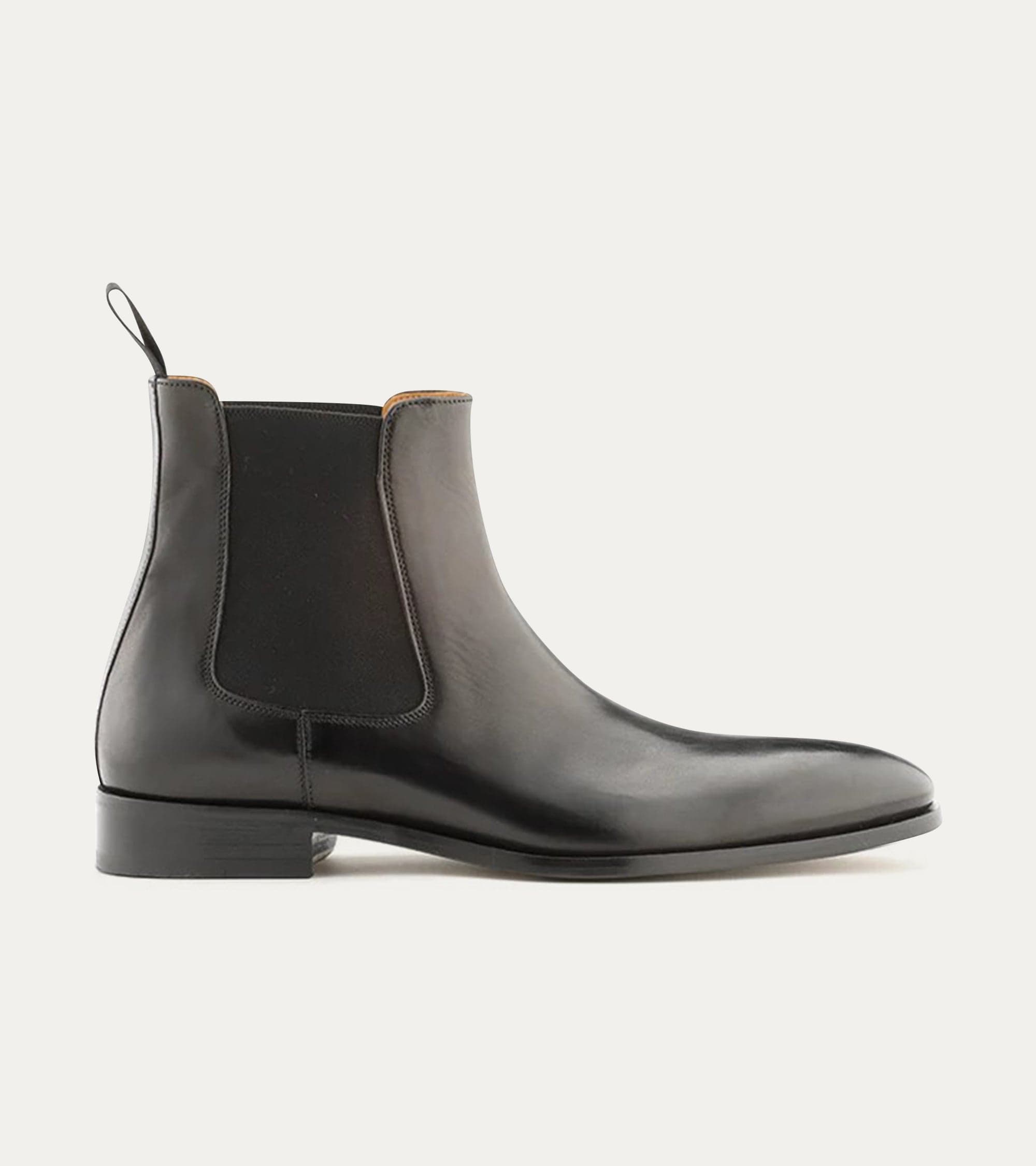 Black Chelsea boot with rounded toe and elastic side panels