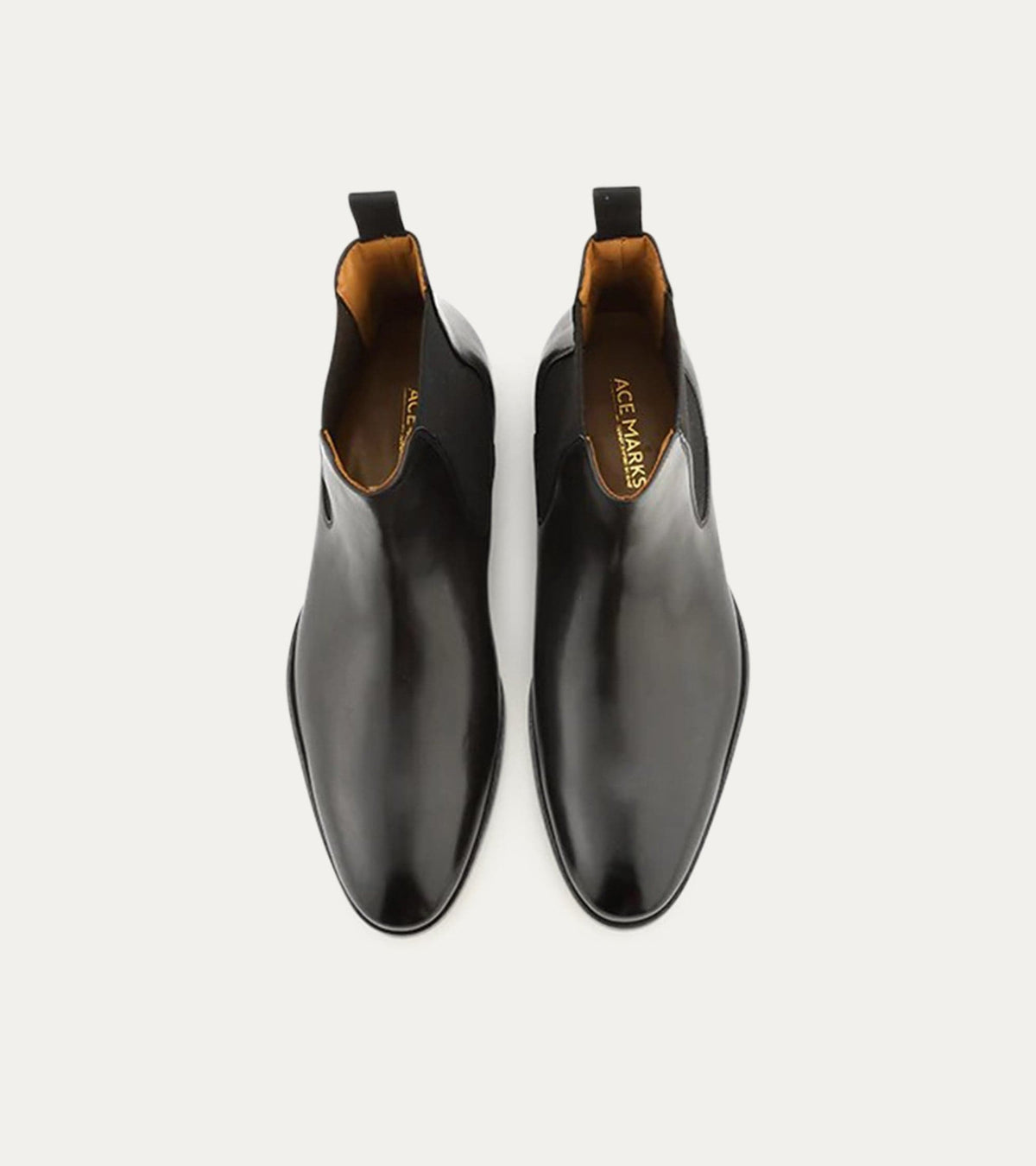 Black Chelsea boot with rounded toe and elastic side panels