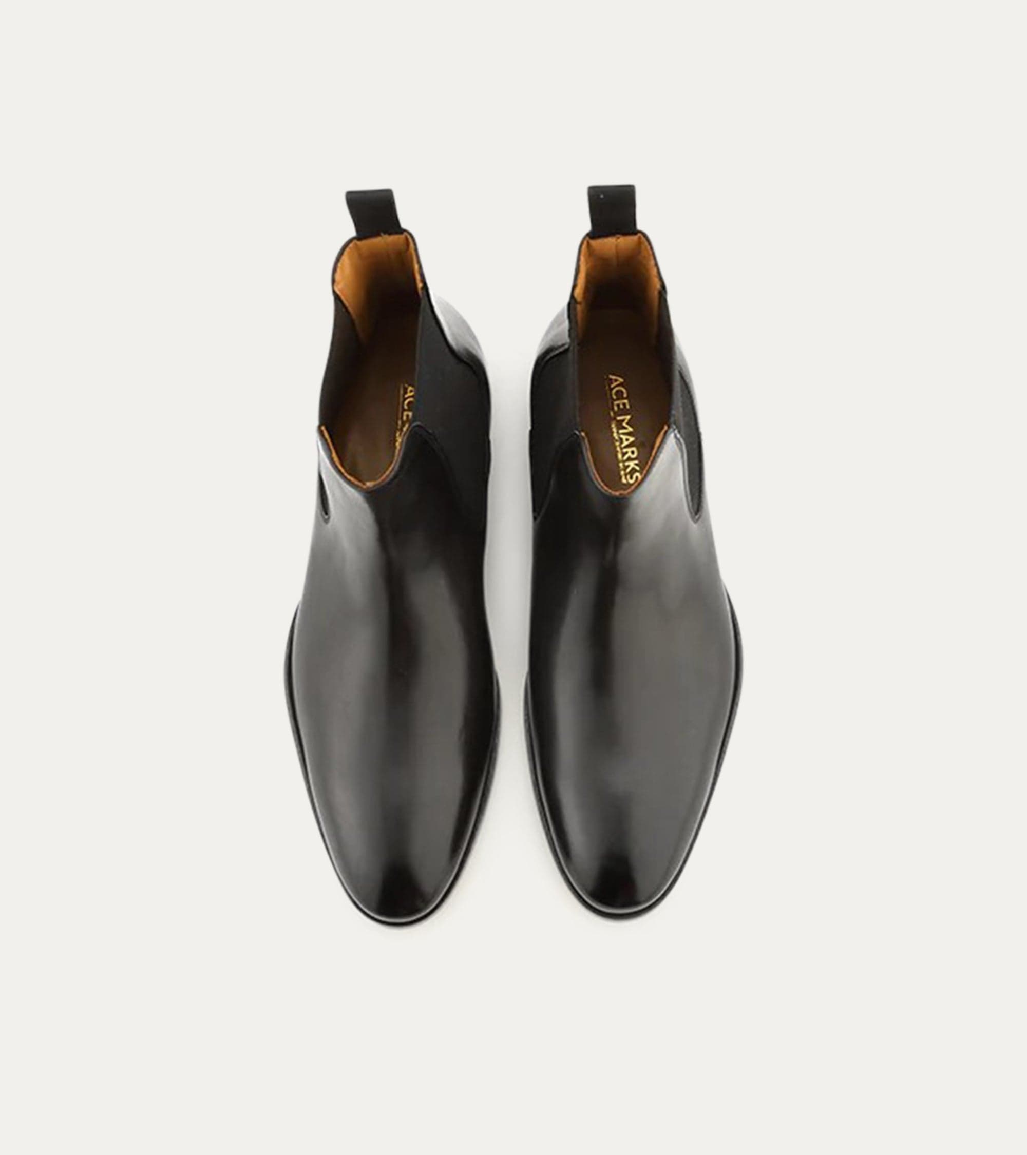 Black Chelsea boot with rounded toe and elastic side panels