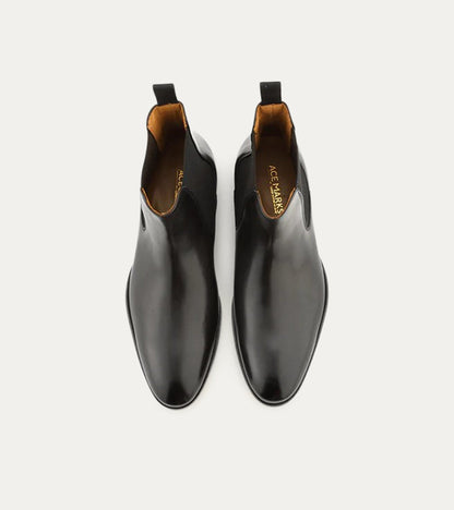 Black Chelsea boot with rounded toe and elastic side panels