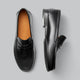 Plain penny loafers with rounded toes, moc stitching and low heels