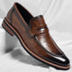 Men's penny loafer with polished finish, round toe and low heel