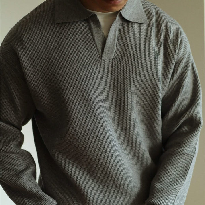 Men's long sleeve textured knit polo shirt with a collared neckline